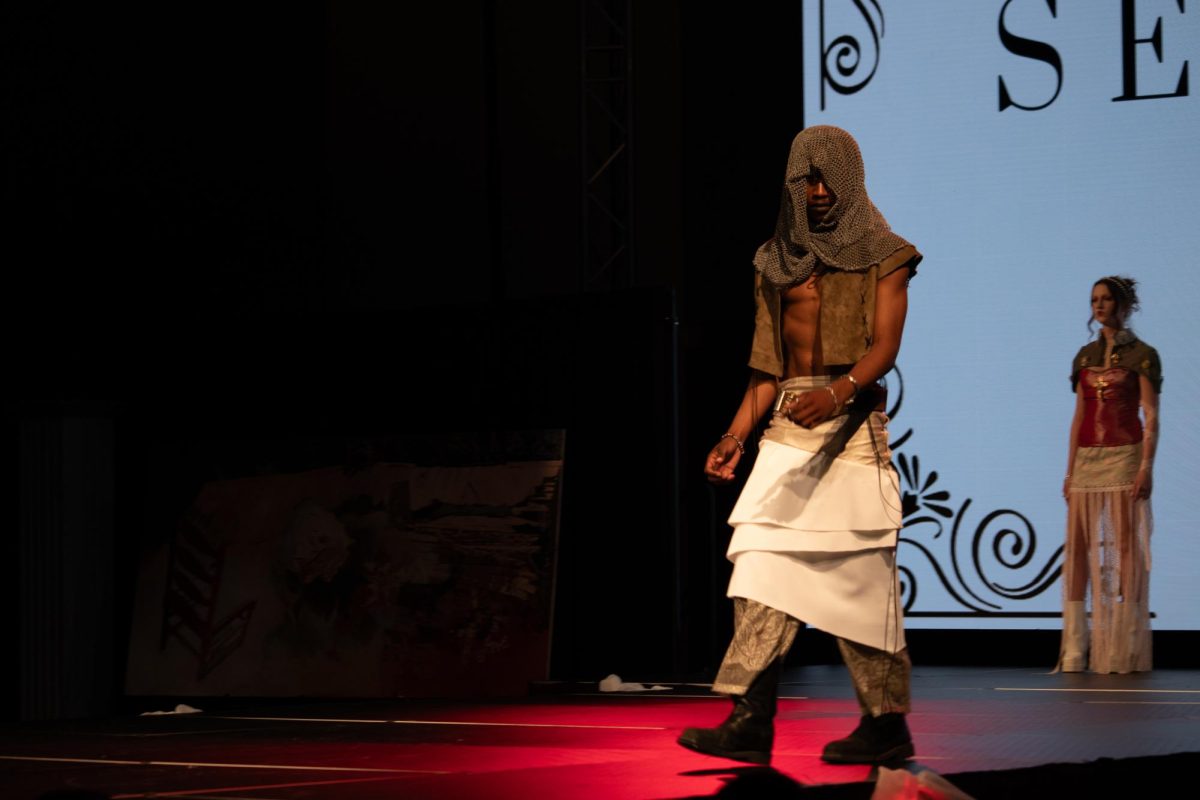 A model strikes a pose on the runway at the TXMD fashion show on April 18, 2026.