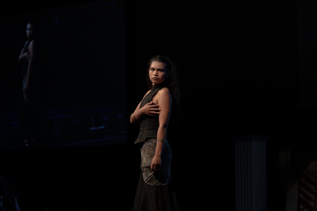 A model strikes a pose on the runway at the TXMD fashion show on April 18, 2026.