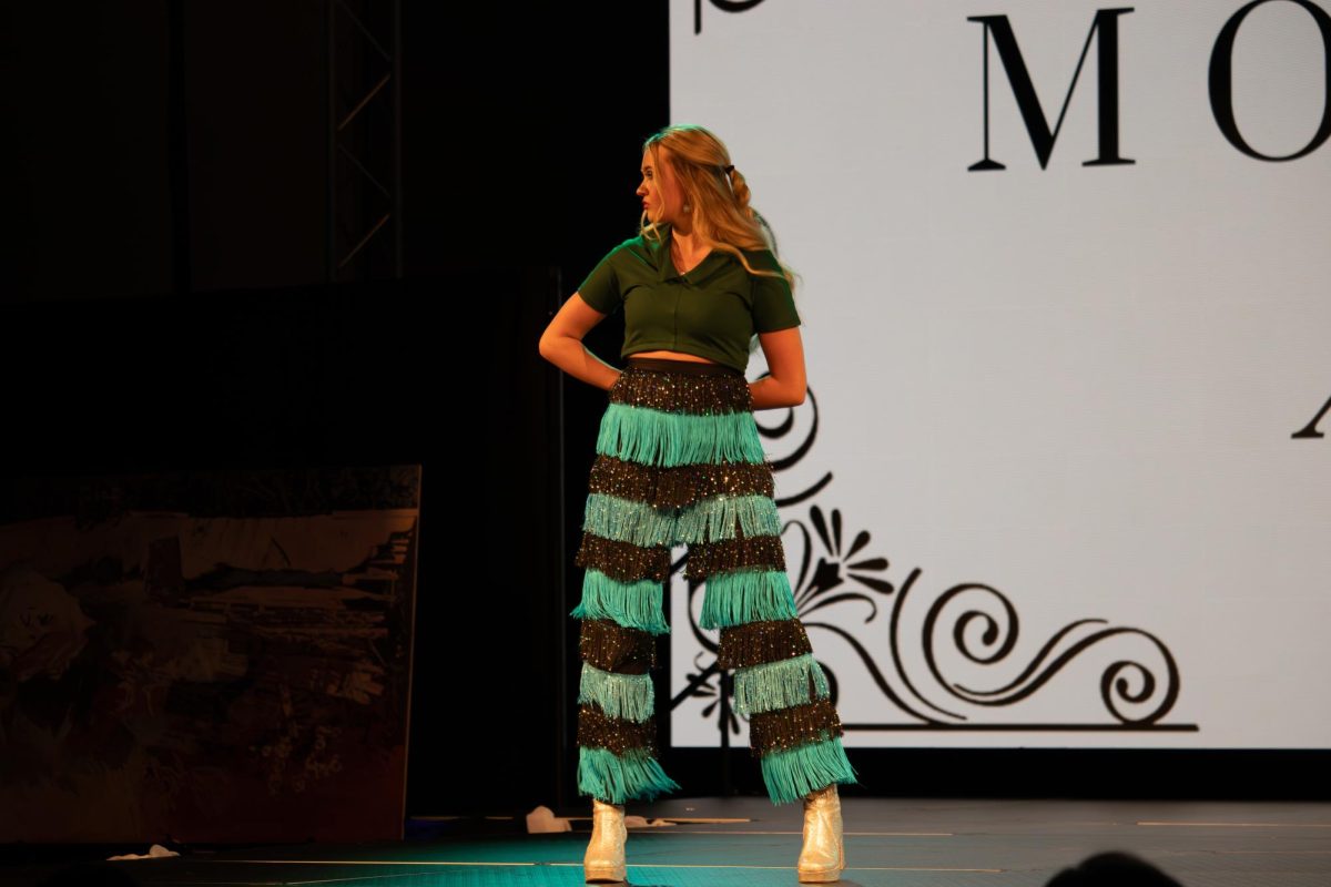 A model strikes a pose on the runway at the TXMD fashion show on April 18, 2026.