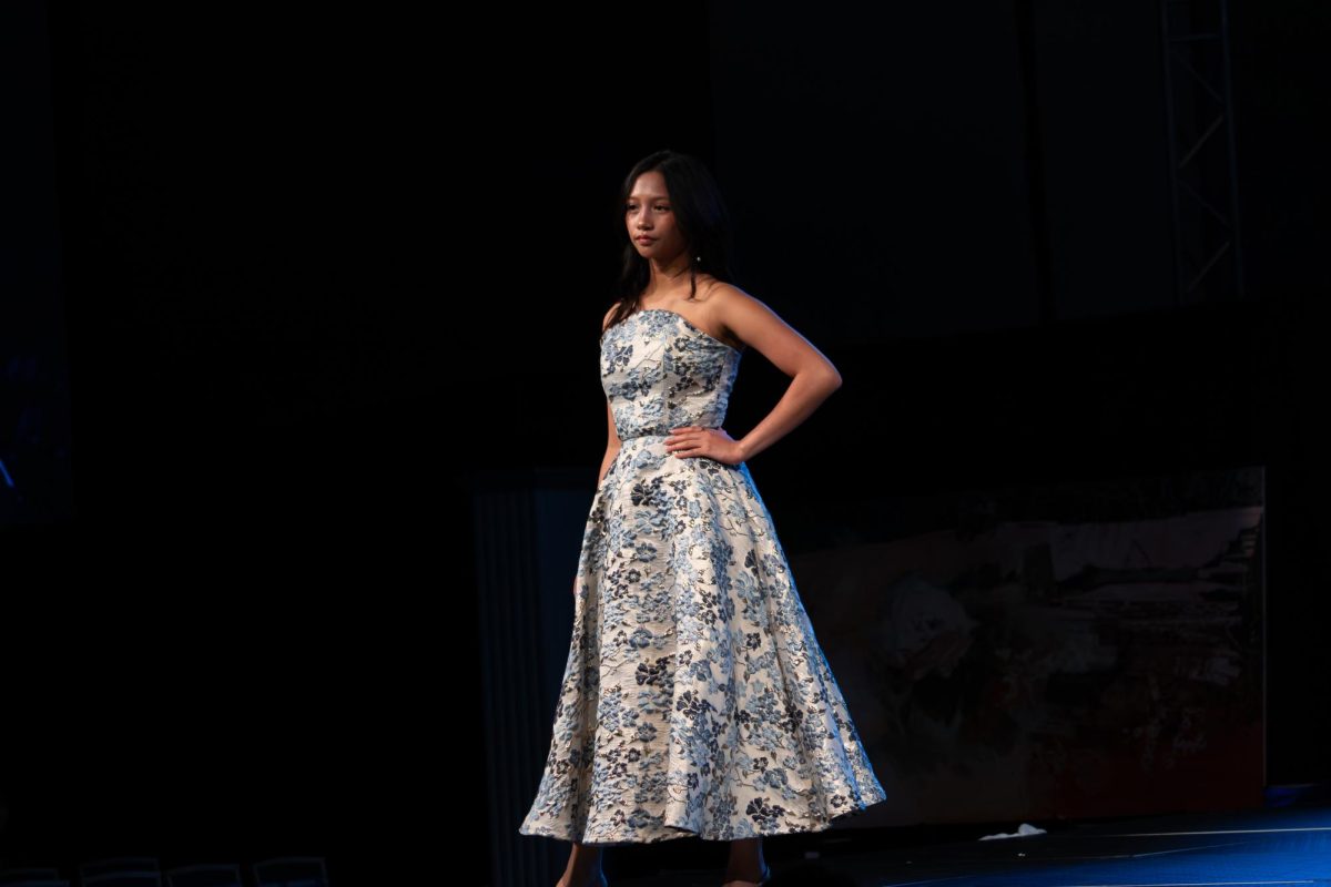 A model strikes a pose on the runway at the TXMD fashion show on April 18, 2026.