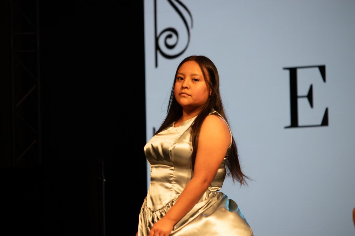 A model strikes a pose on the runway at the TXMD fashion show on April 18, 2026.
