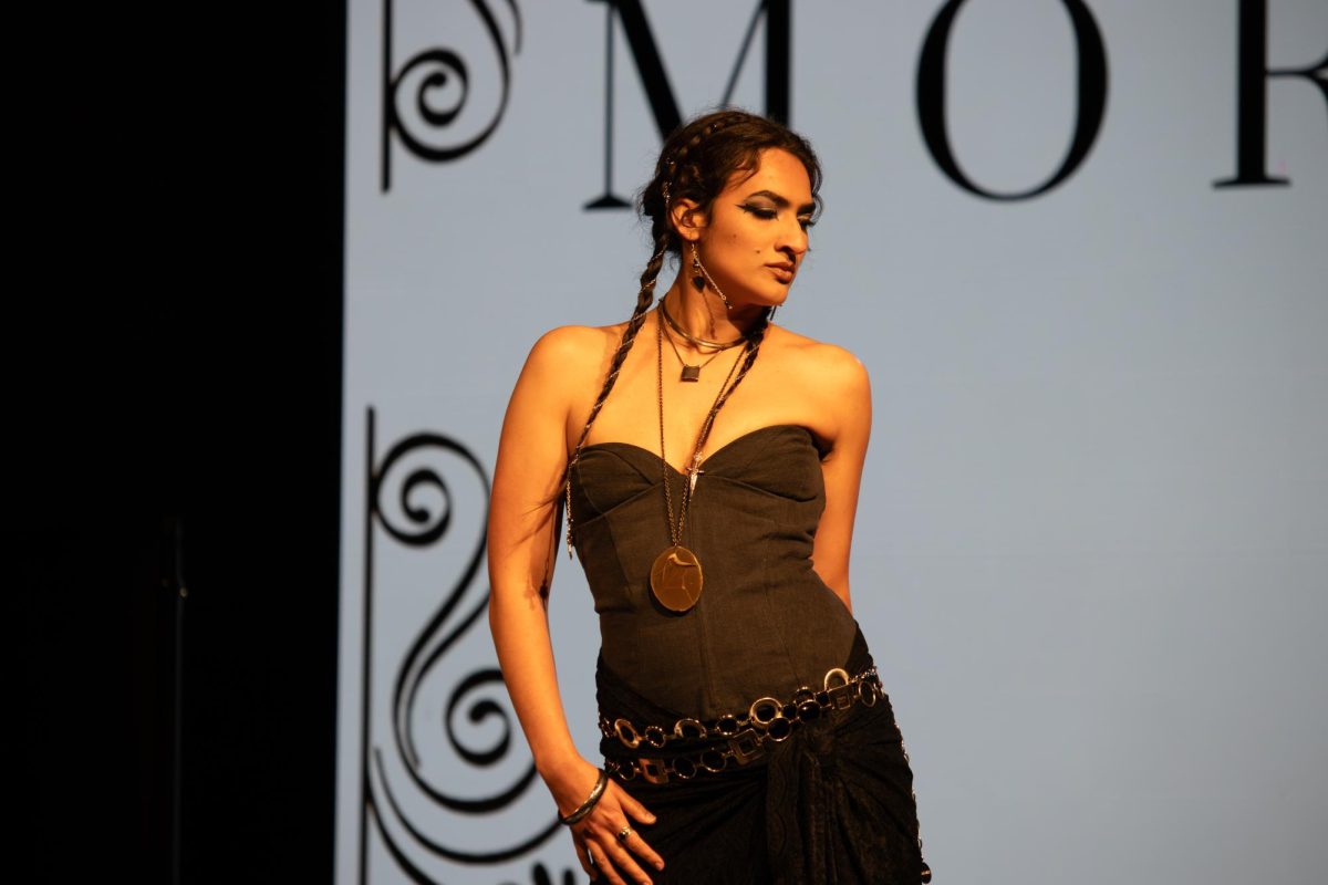 A model strikes a pose on the runway at the TXMD fashion show on April 18, 2026.