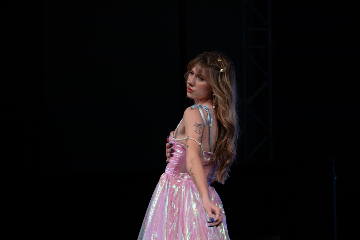 A model strikes a pose on the runway at the TXMD fashion show on April 18, 2026.