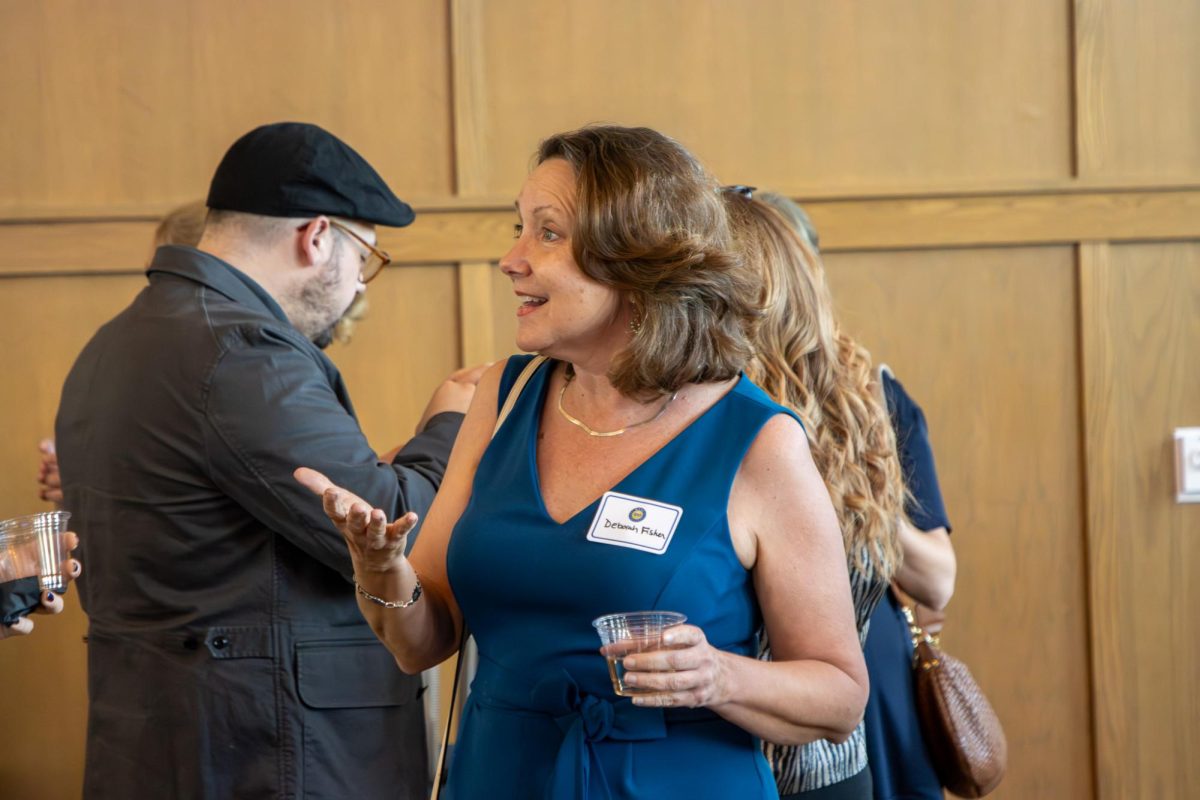 MTSU professor Deborah Fisher talks to other guests during the MTSU Sidelines 100 Years Celebration at Riverside Revival in Nashville, Tennessee, on April 9, 2026. 