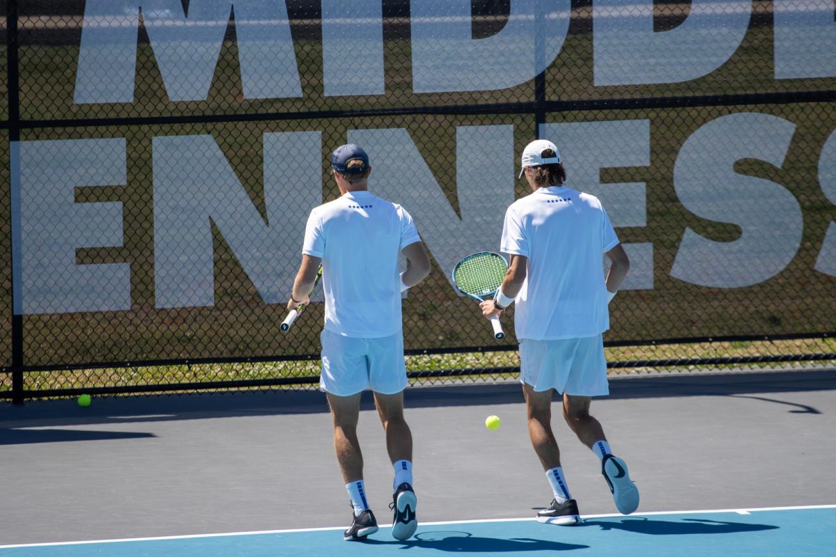 Ondrej Horak (left) and Antoine Mayoral (left) strategize between points in doubles during the CUSA men's tennis championships against Liberty University at the Outdoor Tennis Complex on April 19, 2026. 