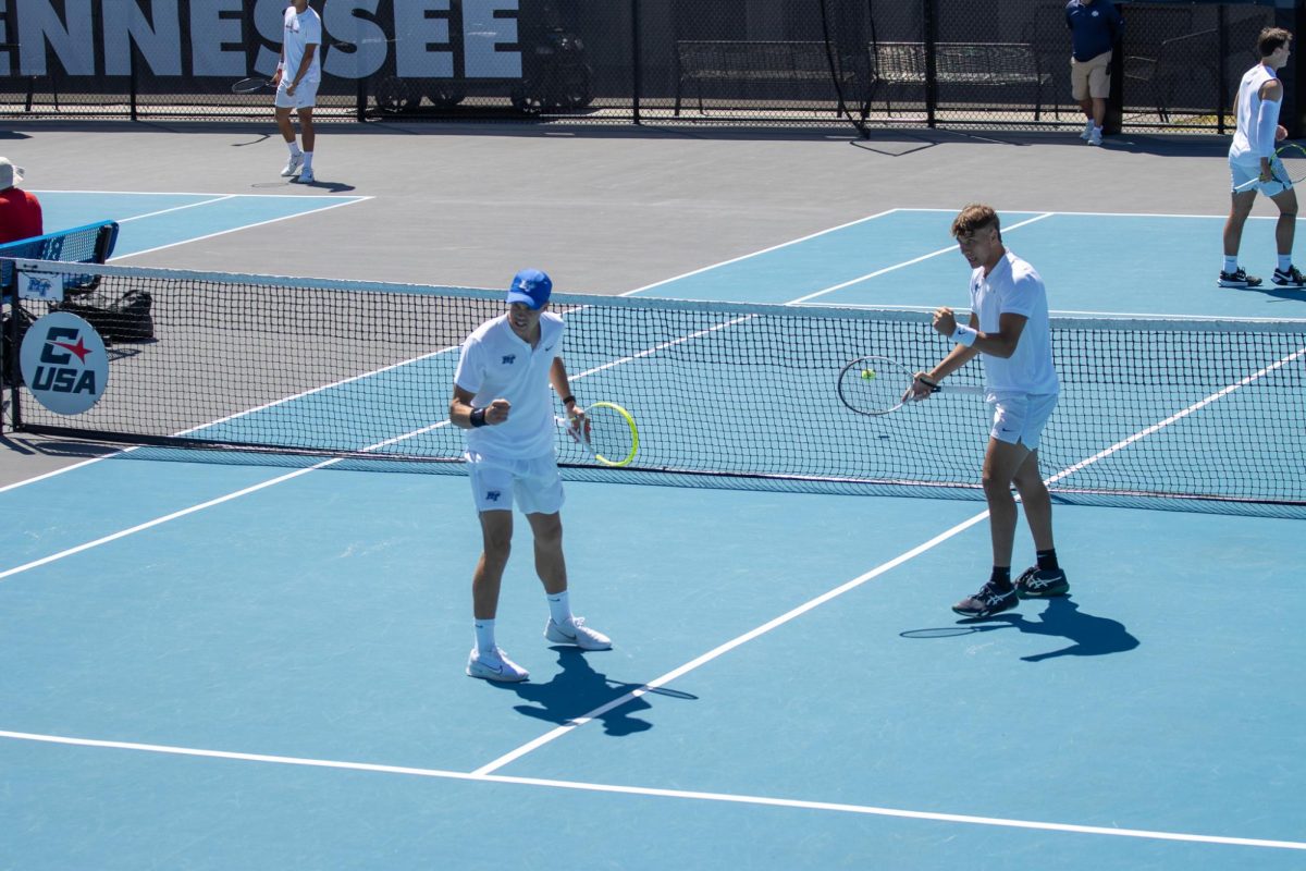 Jonasz Dziopak (left) and Eric Crevei (right) fist pump after a point in doubles during the CUSA men's tennis championships against Liberty University at the Outdoor Tennis Complex on April 19, 2026. 