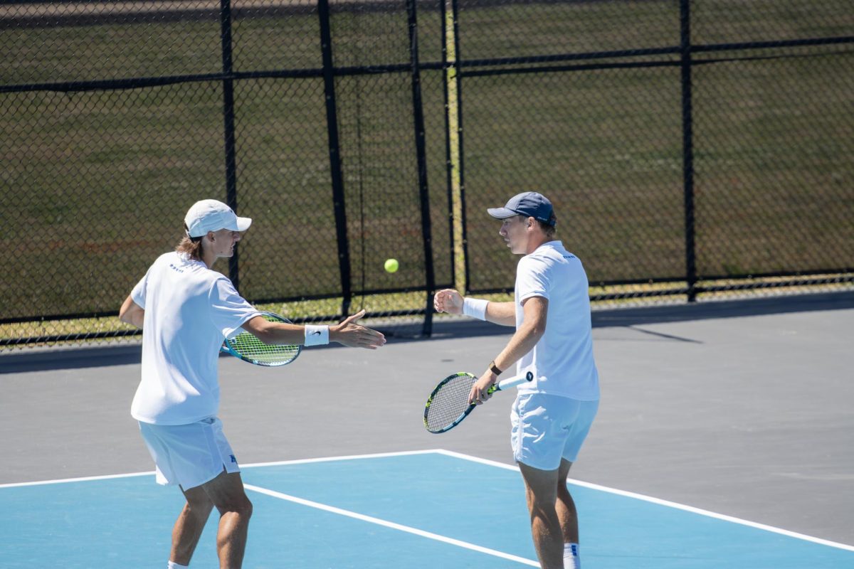 Antoine Mayoral (left) and Ondrej Horak (right) celebrate a point together in doubles during the CUSA men's tennis championships against Liberty University at the Outdoor Tennis Complex on April 19, 2026. 