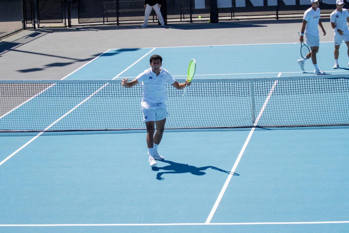 Birtan Duran pumps his fist in excitement after scoring a point during the CUSA men's tennis championships against Liberty University at the Outdoor Tennis Complex on April 19, 2026. 