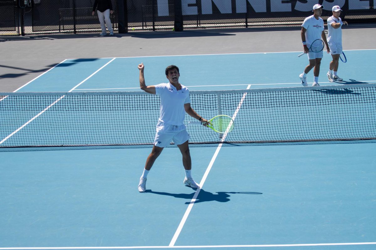 Birtan Duran turns to the crowd in celebration after scoring a point in doubles during the CUSA men's tennis championships against Liberty University at the Outdoor Tennis Complex on April 19, 2026. 