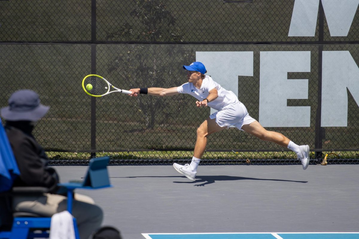 Jonasz Dziopak stretches out to return a shot during the CUSA men's tennis championships against Liberty University at the Outdoor Tennis Complex on April 19, 2026. 