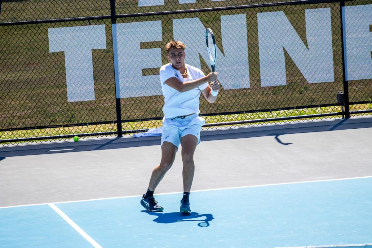 Eric Crevei returns a volley in singles during the CUSA men's tennis championships against Liberty University at the Outdoor Tennis Complex on April 19, 2026. 