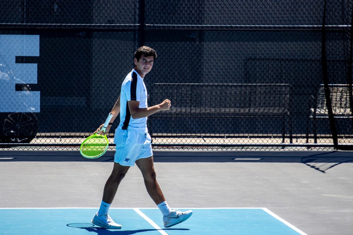 Birtan Duran pumps his first after scoring a point during the CUSA men's tennis championships against Liberty University at the Outdoor Tennis Complex on April 19, 2026. 