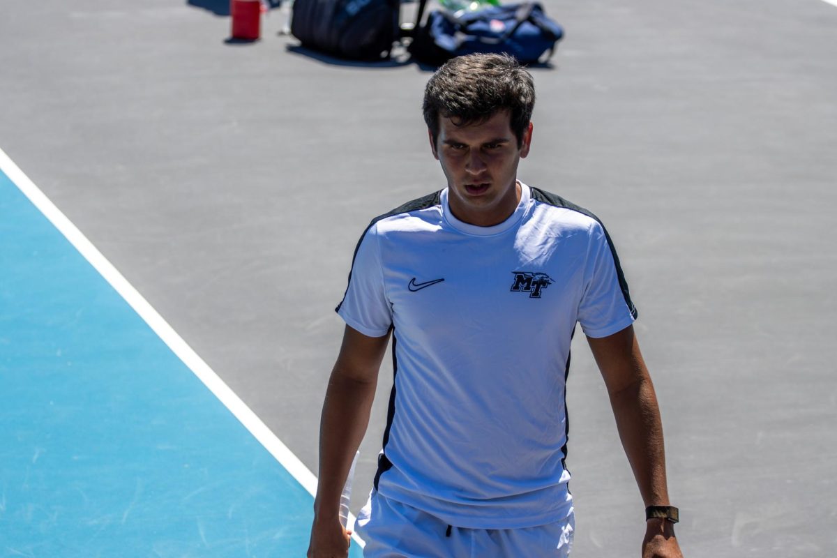 Birtan Duran walks to the baseline after a change over during the CUSA men's tennis championships against Liberty University at the Outdoor Tennis Complex on April 19, 2026. 