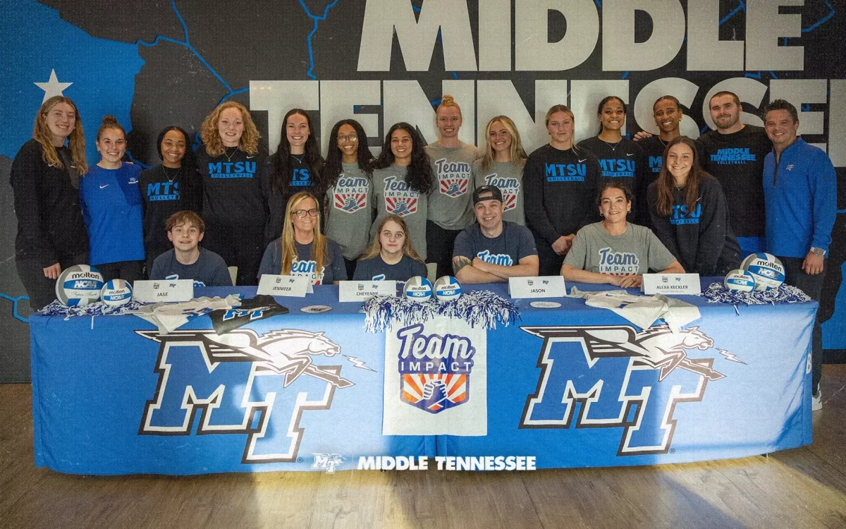 Members of the MTSU Volleyball team posing with Cheyenne Shuler and members of her family on Team Impact signing day on March 26, 2026 at the Student Athlete Performance Center. 
