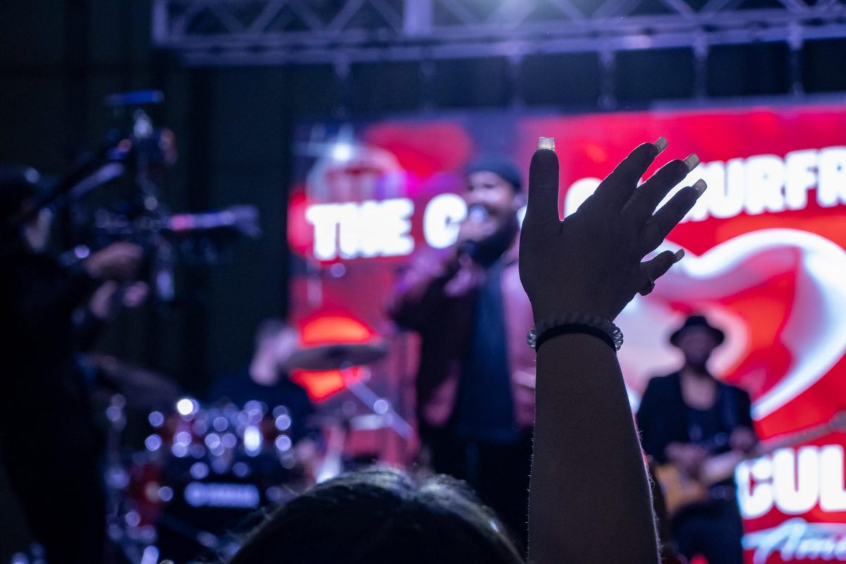 A fan waves her hand during Jordan McCullough's performance at the Richard Siegel Soccer Complex on May 6, 2026.
