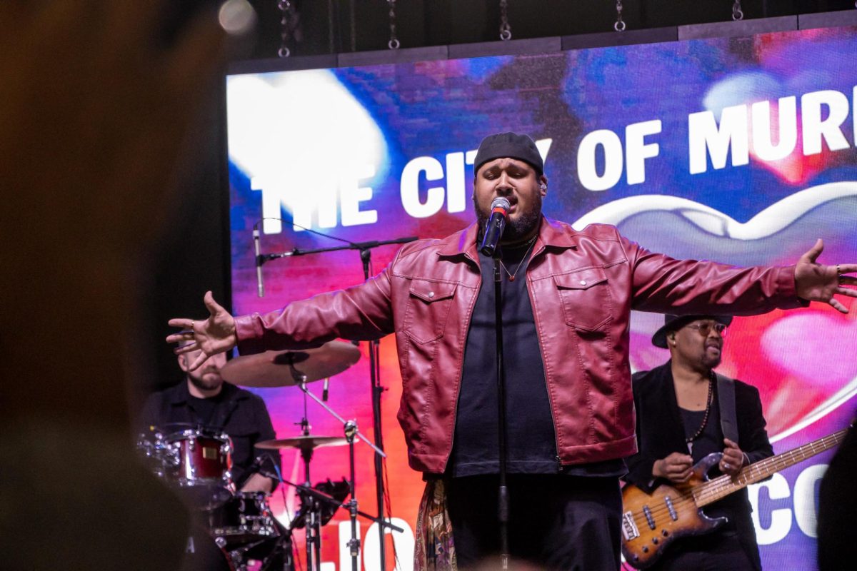 Jordan McCullough sings with outstretched arms during his performance at the Richard Siegel Soccer Complex on May 6, 2026.