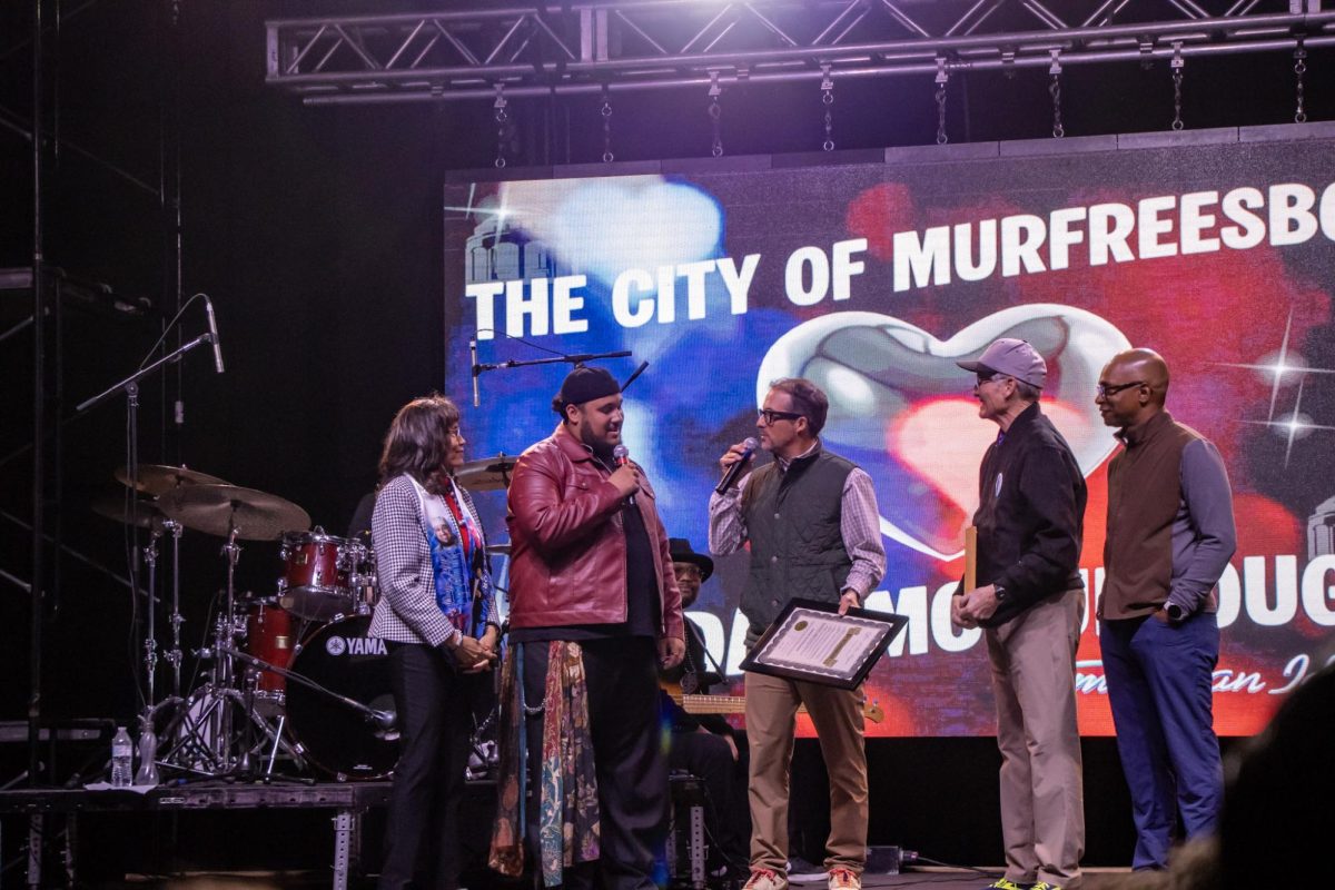 Murfreesboro Mayor Shane McFarland gifts Jordan McCullough a proclamation declaring May 6 Jordan McCullough Day in Murfreesboro at the Richard Siegel Soccer Complex on May 6, 2026.