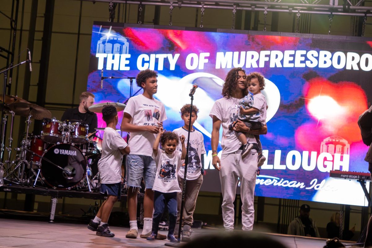 Jordan McCullough's six siblings watch Jordan come on stage before he performs at the Richard Siegel Soccer Complex on May 6, 2026.