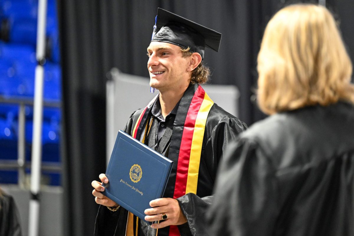 MTSU men's tennis player Karim Al-Amin poses for a picture after receiving his diploma during spring commencement inside the Murphy Center on May 9, 2026.