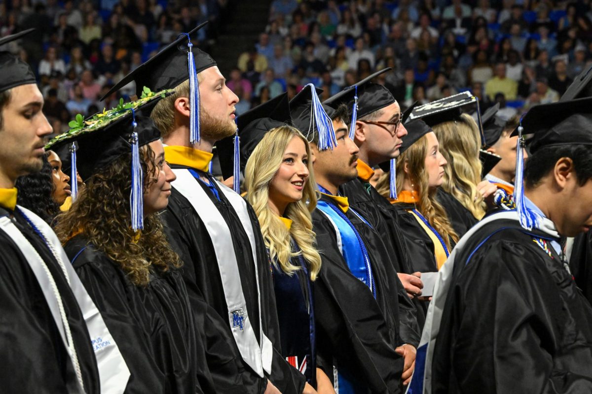 Candidates for graduation stand as they are being recognized as candidates of a bachelors degree during spring commencement inside the Murphy Center on May 9, 2026.