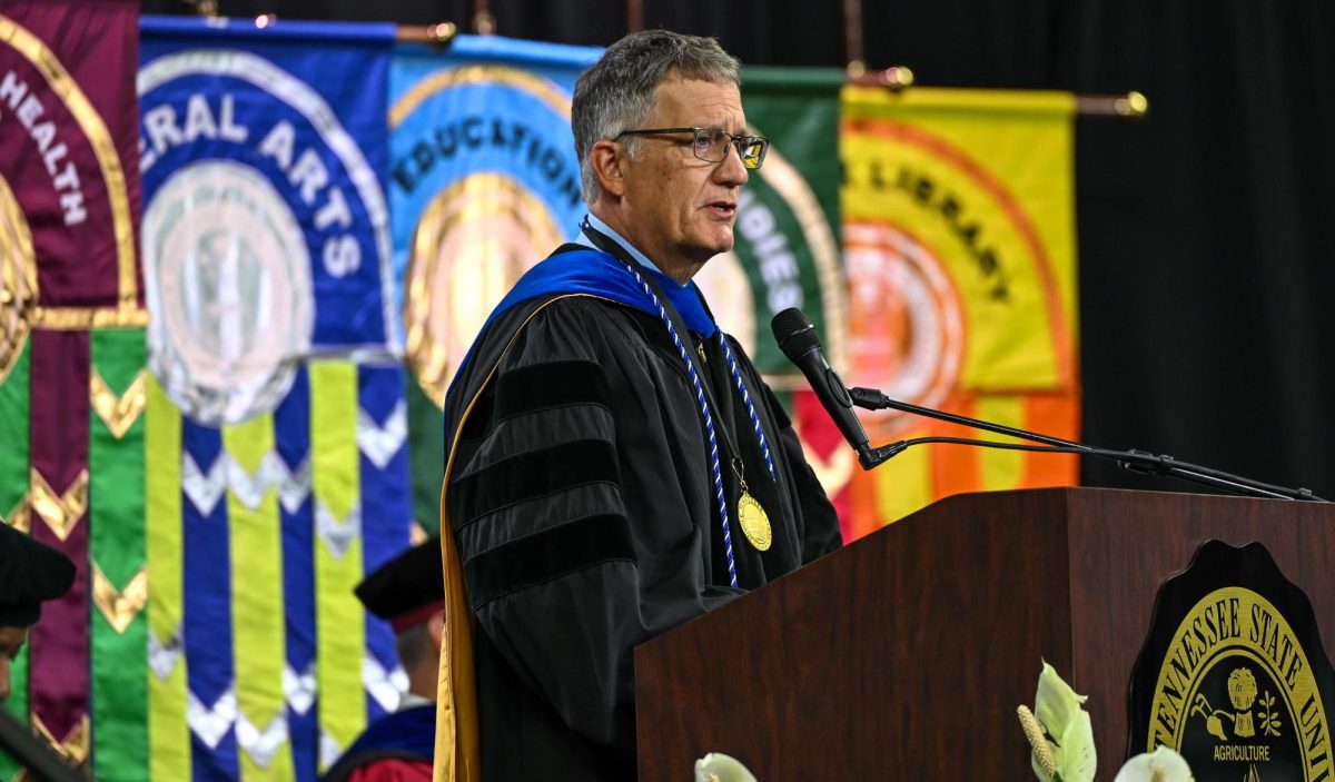 MTSU provost Mark Byrnes speaks to the crowd of graduates during spring commencement inside the Murphy Center on May 9, 2026.