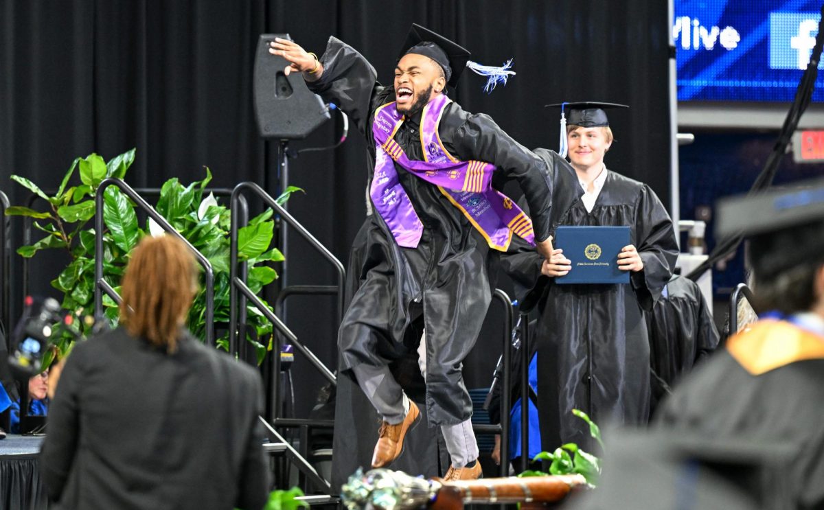 MTSU graduate Darren Osborne Jr. dances after receiving his diploma during spring commencement inside the Murphy Center on May 9, 2026.