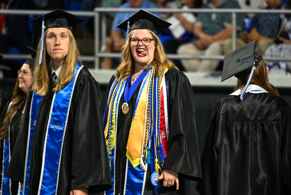 MTSU Sidelines Editor-in-chief Jenene Grover sticks her tongue out during spring commencement inside the Murphy Center on May 9, 2026.