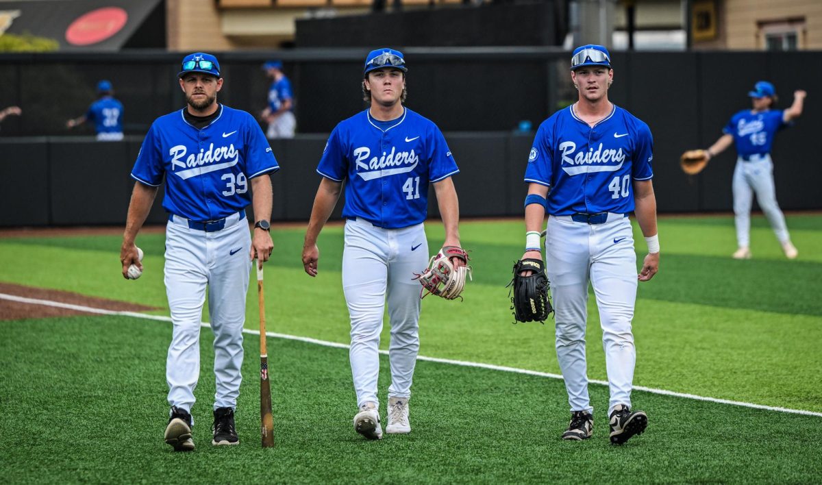 MTSU assistant coach Ryan Huber (left), infielder Calvin Cook (middle) and outfielder Konnor Bowden (right) walk towards the dugout before a game against Jacksonville State University at Mickey Dunn Stadium on May 21, 2026. 