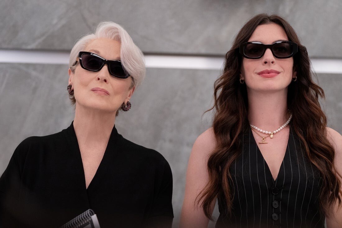 Meryl Streep (left) and Anne Hathaway (right) on set. (Courtesy of Disney)