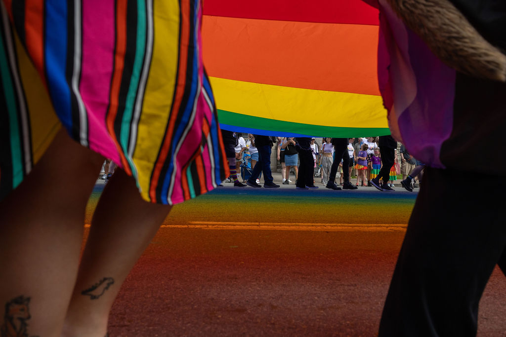 Pride flag reflecting colors onto Broadway in Nashville, Tennessee on June 29, 2026.