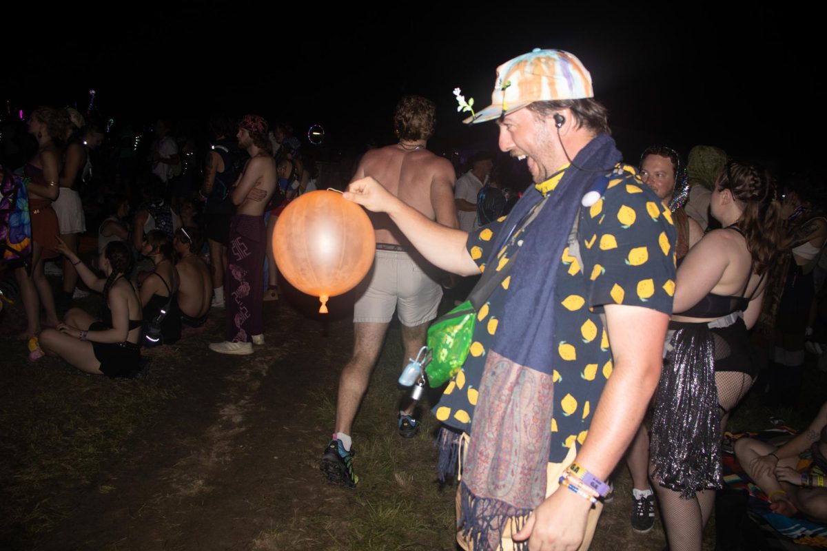 Fan throws balloon in the main What Stage area at Bonnaroo Music & Arts Festival, 2026. 