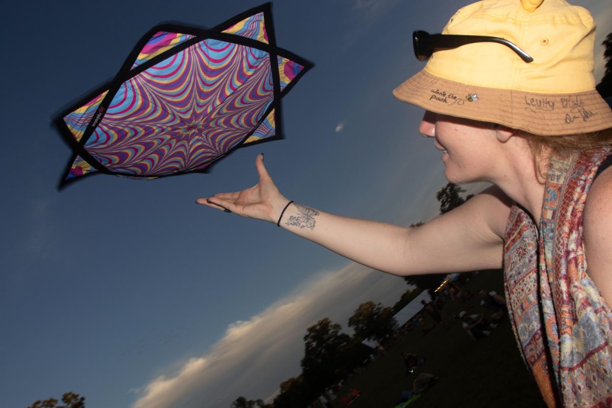 Fan releases and holds out a "mougee" — popular art props —in the air at Bonnaroo Music & Arts Festival, 2026. 