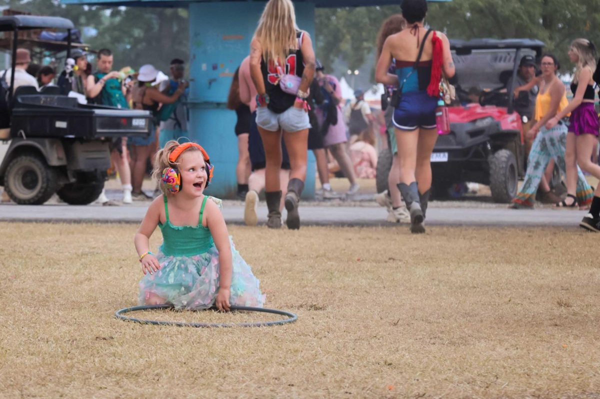 A child enjoys a moment of joy away from the music at Bonnaroo Music & Arts Festival in Manchester, Tennessee.