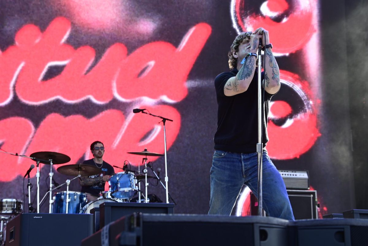 Spiritual Cramp's lead singer, Michael Bingham, sings into his microphone on Thursday, June 11, 2026