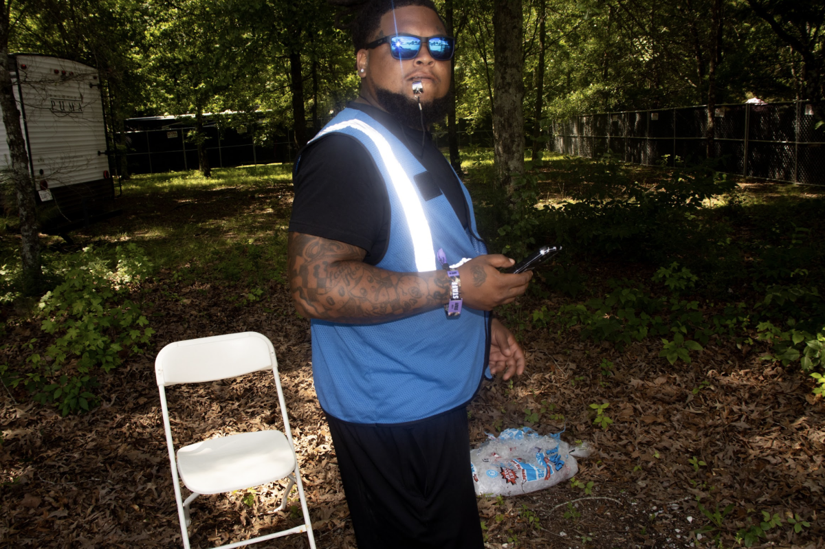 Security guard poses outside on entrance at Bonnaroo Music & Arts Festival, 2026
