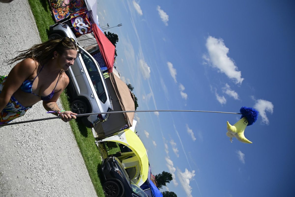 Alex Strasser shows off the group totem for camp HypnoToad which lets them spot each other from far away at Bonnaroo Music & Arts Festival in Manchester, Tennessee, on June 11, 2026.