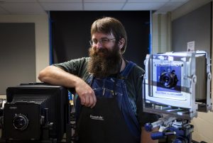 MTSU director of photography Jonathan Trundle poses for a portrait inside the MTSU Photography Building.
